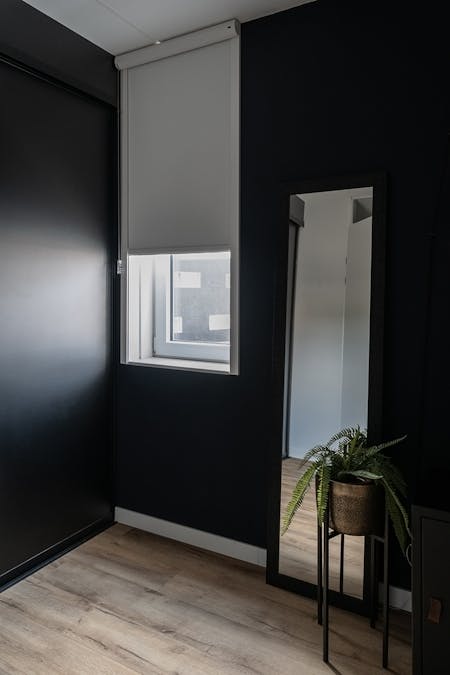 Rolgordijn met zijgeleiding - inhuis plaza