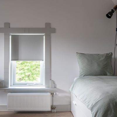 Verduisterend rolgordijn in slaapkamer